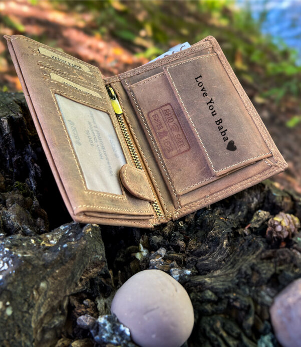 This handcrafted vertical wallet is made for the modern man. Personalize it with initials or a message for a birthday or Father's Day surprise. Made with durable full-grain leather and RFID-blocking lining, it's both stylish and secure. #CustomWallet #LeatherGift #GiftForHim #WalletForMen #RFIDProtection #VerticalWallet #MensStyle #BirthdayGiftForDad